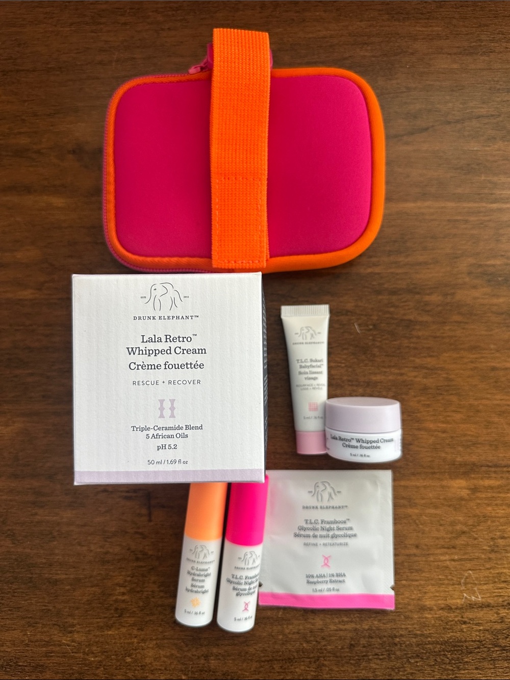 Drunk Elephant Skincare Set — Bright Pink and Orange Travel Pouch